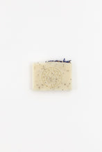 Load image into Gallery viewer, Close-up of Meadow natural handmade soap bar showing exfoliating poppy seeds and delicate blue cornflowers